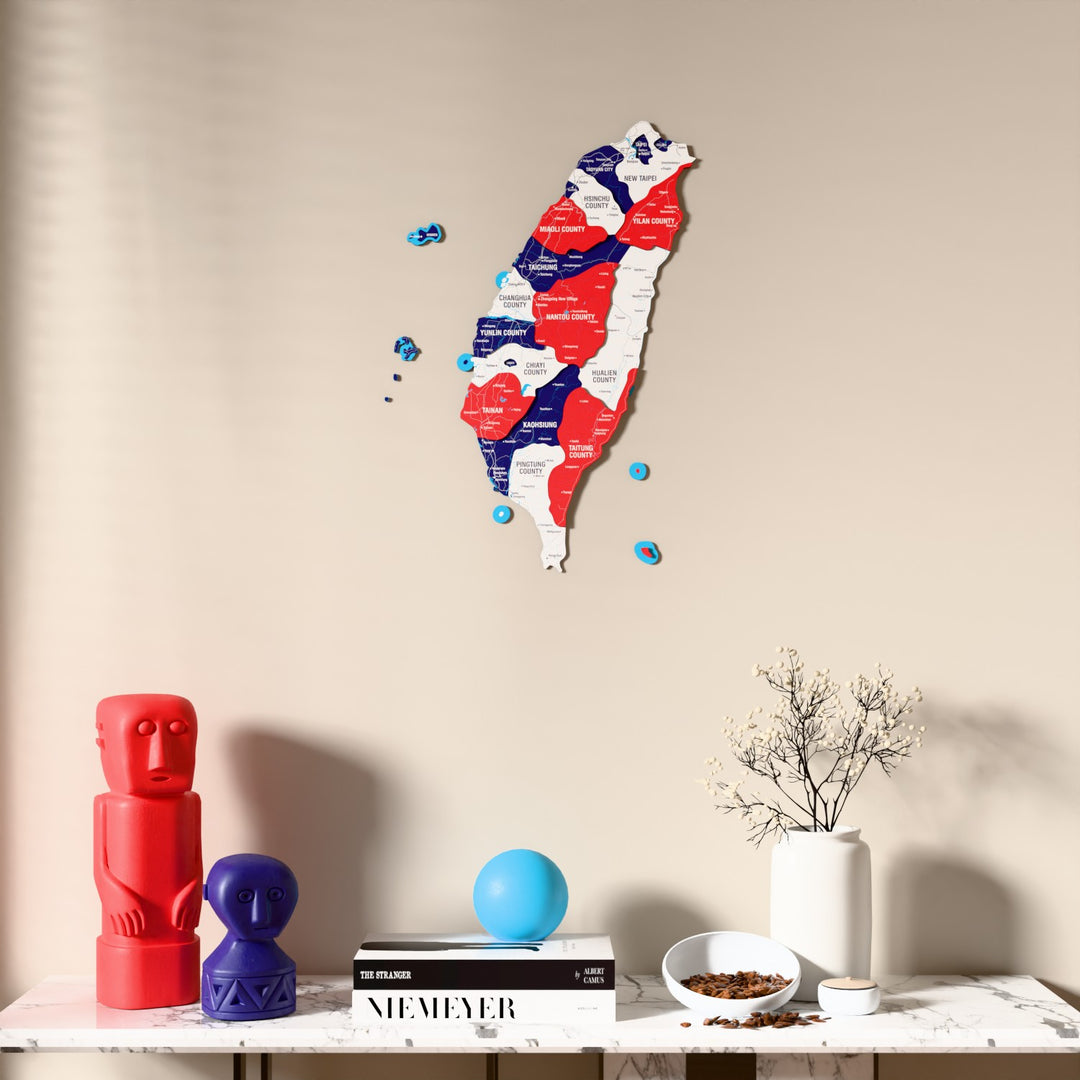 Flag colored Taiwan wooden wall map above a marble console, front view