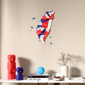 Flag colored Taiwan wooden wall map above a marble console, front view