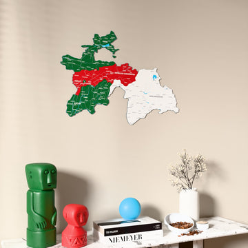 Flag colored Tajikistan wooden wall map on a beige wall above a console with figurines