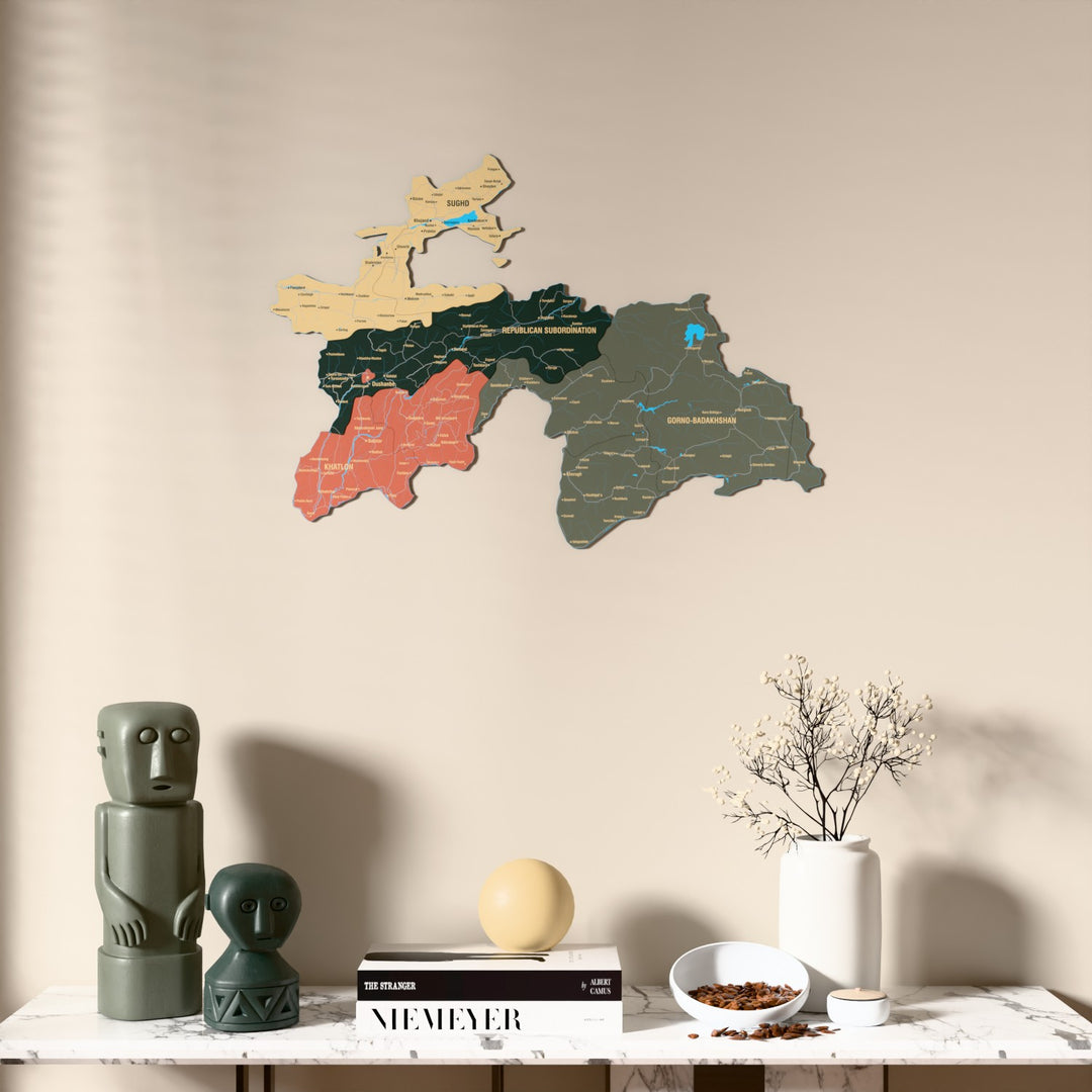 Sage Tajikistan wooden wall map above a marble console, front view
