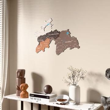 Soil Tajikistan wooden wall map beside a sheer curtain, angled view