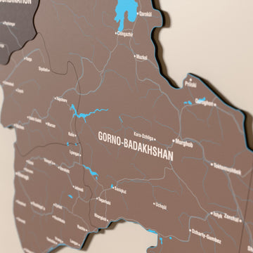 Close-up of the Soil Tajikistan wooden wall map with layered regions and printed names