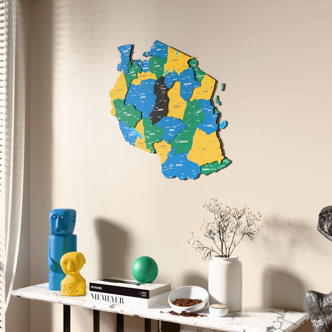 Flag colored Tanzania wooden wall map beside a sheer curtain, angled view