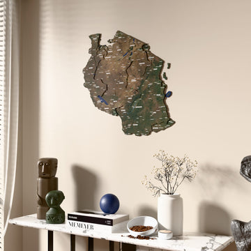 Satellite Tanzania wooden wall map beside a sheer curtain, angled view