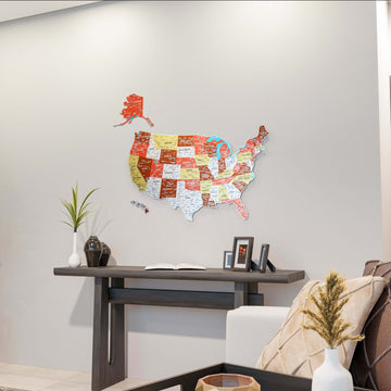 Small terracotta metal USA wall map above a dark console table, wide view