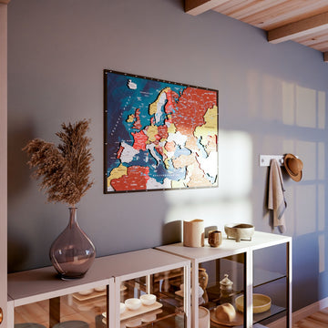 Wooden Europe map with rivers in Terracotta, above a shelf unit with a pampas vase