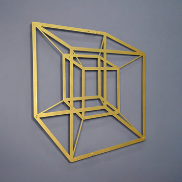 Gold tesseract cube metal wall art, close view at a slight angle