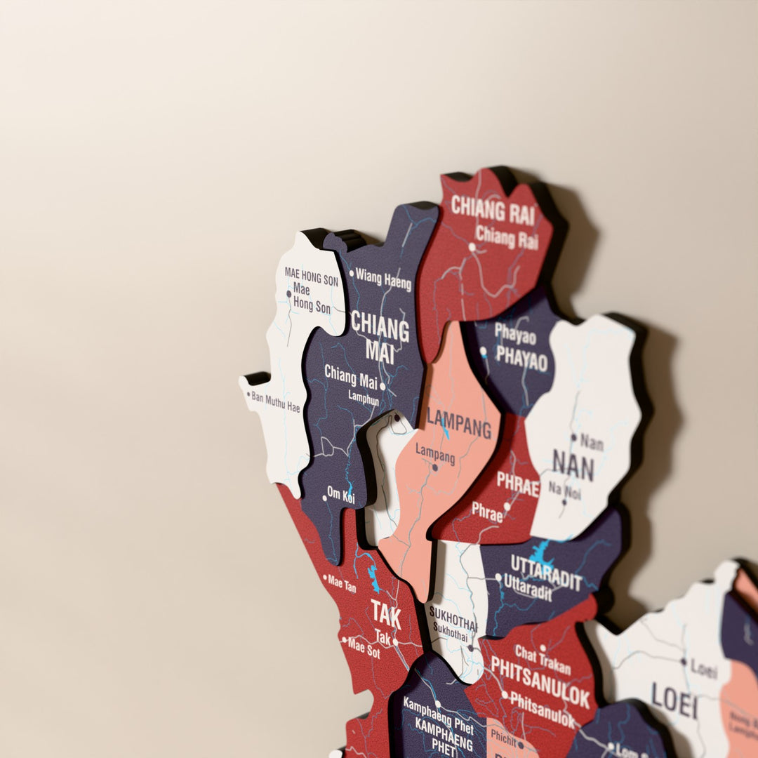 Close-up of the Flag colored Thailand wooden wall map with layered regions and printed names