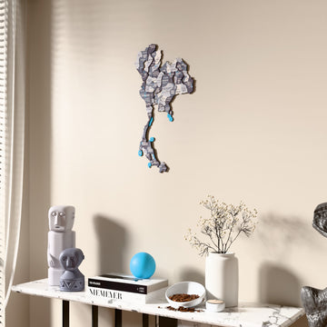 Nimbus Thailand wooden wall map beside a sheer curtain, angled view