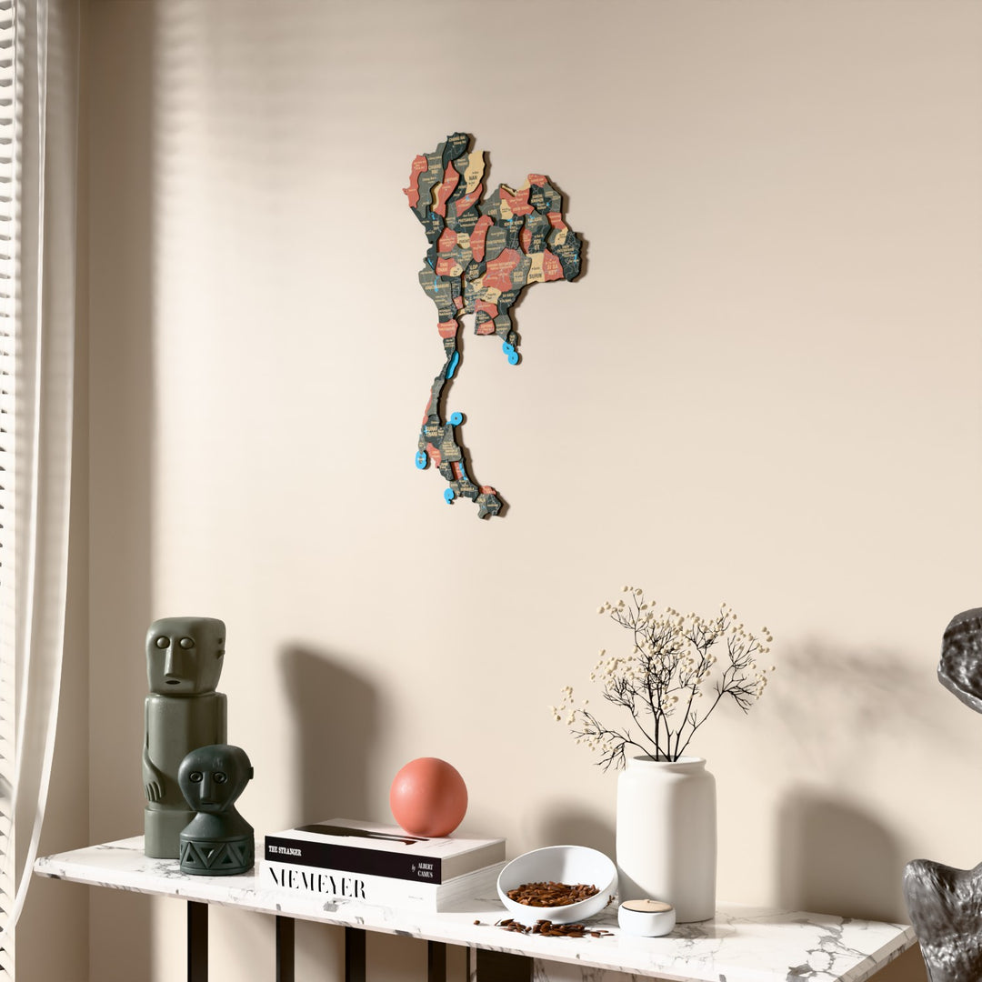 Sage Thailand wooden wall map beside a sheer curtain, angled view