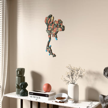 Sage Thailand wooden wall map beside a sheer curtain, angled view