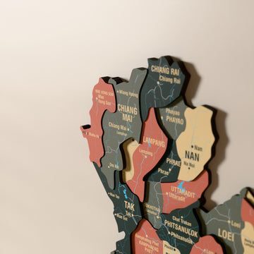 Close-up of the Sage Thailand wooden wall map with layered regions and printed names