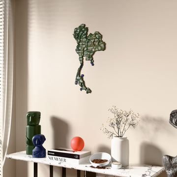 Satellite Thailand wooden wall map beside a sheer curtain, angled view