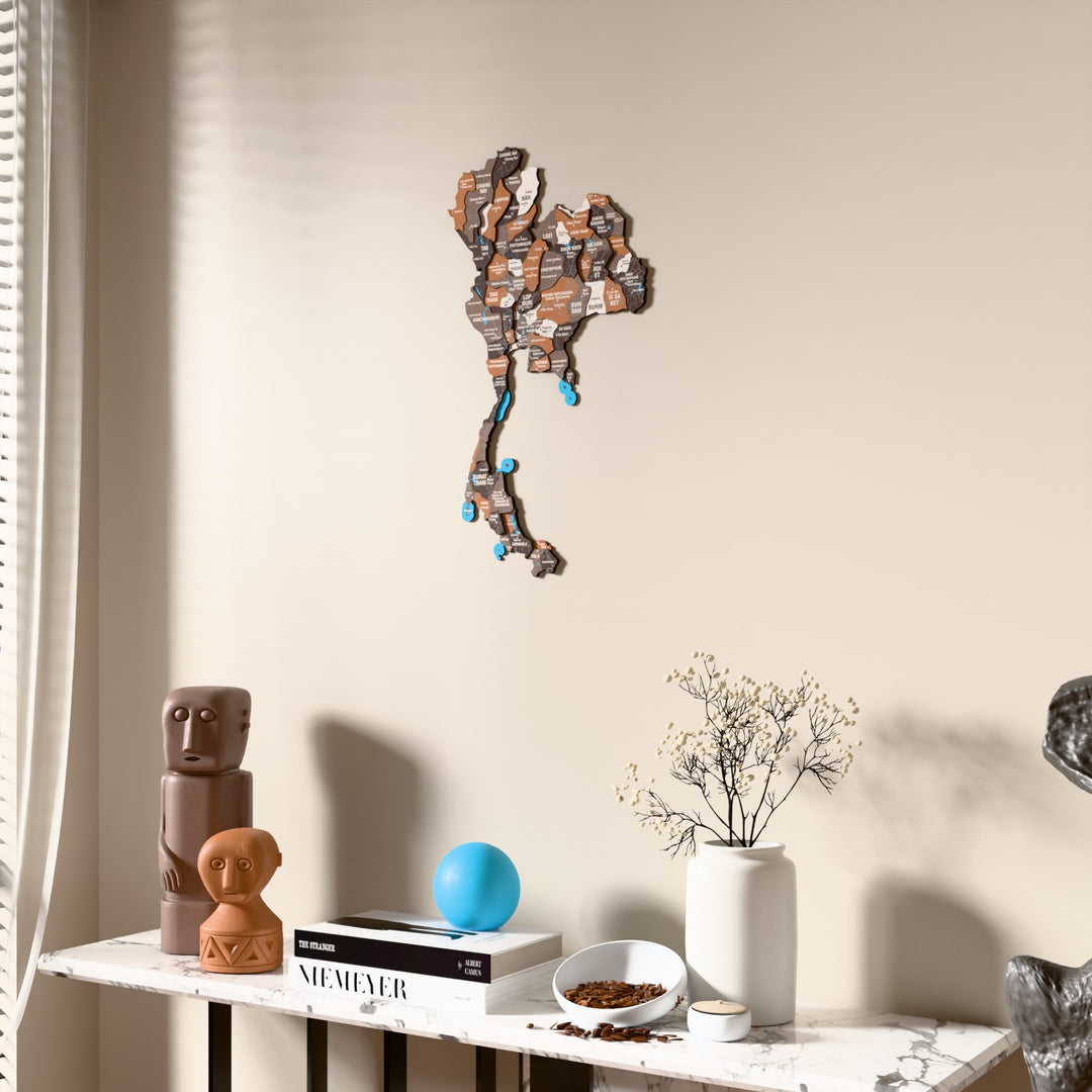Soil Thailand wooden wall map beside a sheer curtain, angled view