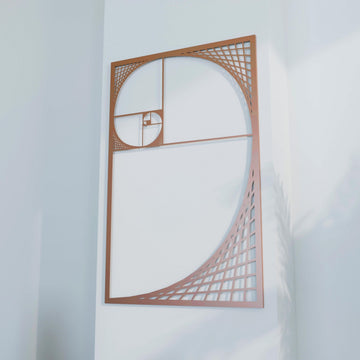 Close view of copper Golden Ratio spiral metal wall decor, angled and filling most of the frame