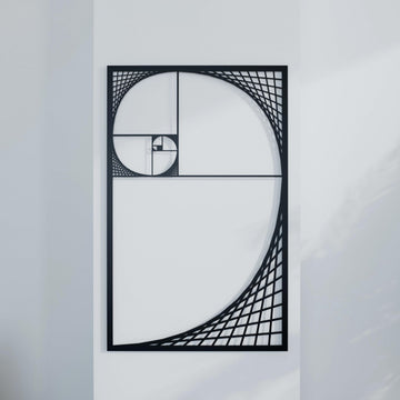Black Golden Ratio Fibonacci spiral metal wall decor, straight-on view against a plain white wall