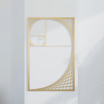 Gold Golden Ratio Fibonacci spiral metal wall decor, straight-on view against a plain white wall