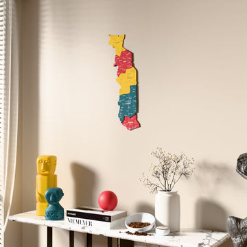 Flag colored Togo wooden wall map beside a sheer curtain, angled view