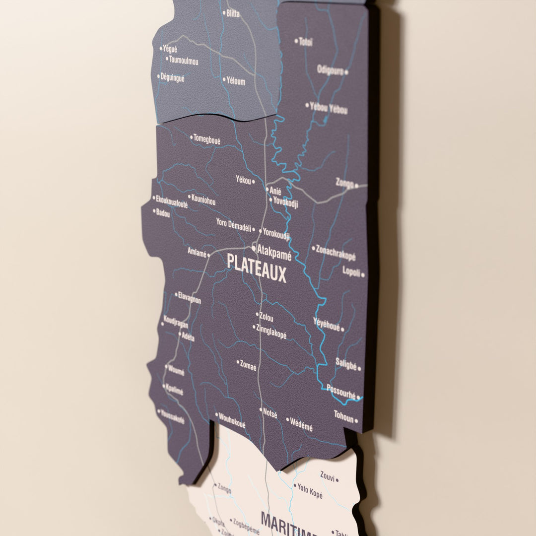 Close-up of the Nimbus Togo wooden wall map with layered regions and printed names