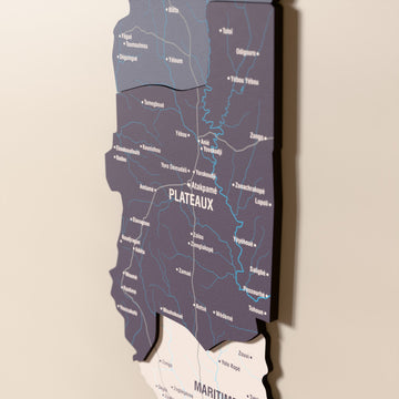 Close-up of the Nimbus Togo wooden wall map with layered regions and printed names