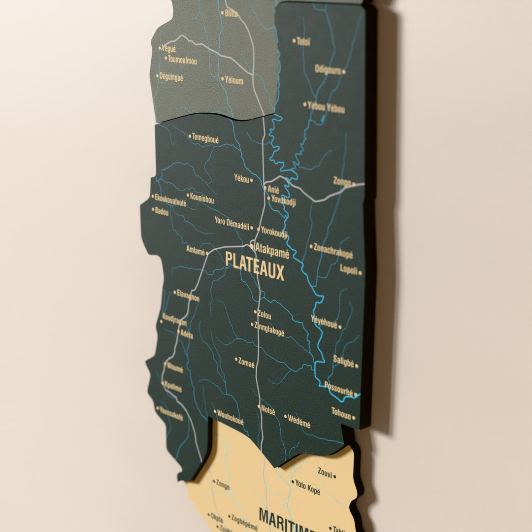 Close-up of the Sage Togo wooden wall map with layered regions and printed names