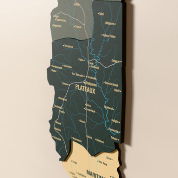 Close-up of the Sage Togo wooden wall map with layered regions and printed names