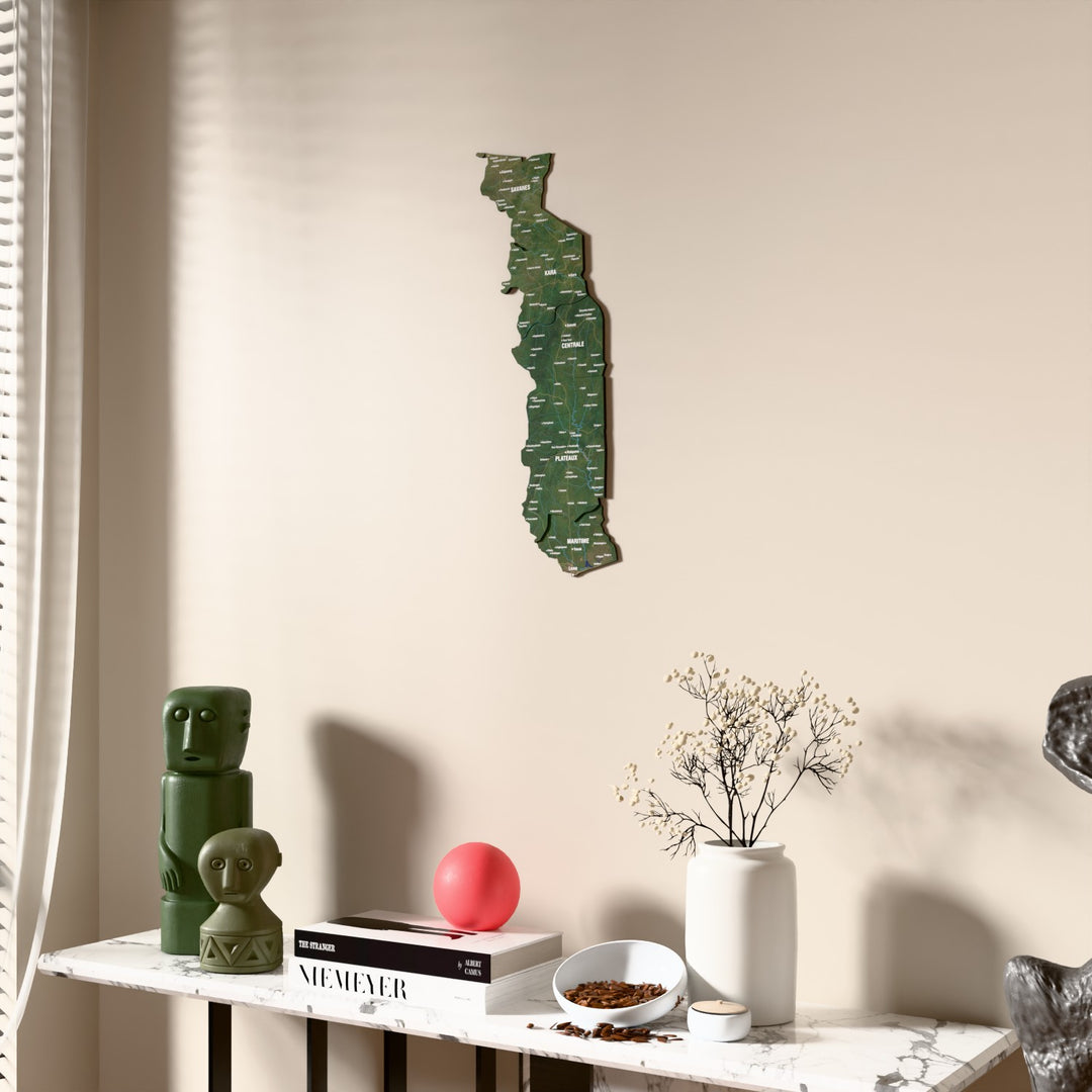 Satellite Togo wooden wall map beside a sheer curtain, angled view