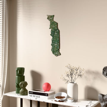 Satellite Togo wooden wall map beside a sheer curtain, angled view