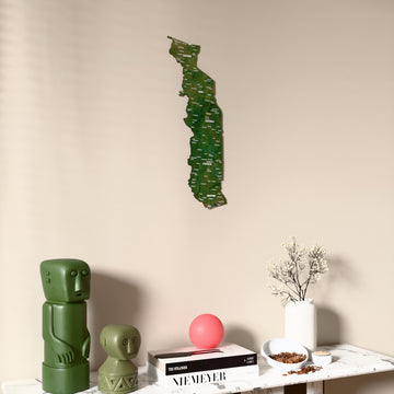 Satellite Togo wooden wall map on a beige wall above a console with figurines