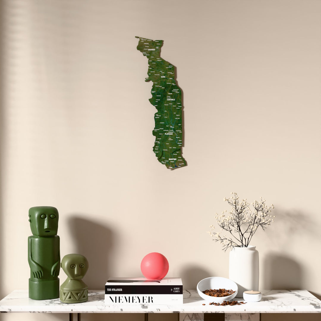 Satellite Togo wooden wall map above a marble console, front view
