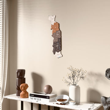 Soil Togo wooden wall map beside a sheer curtain, angled view
