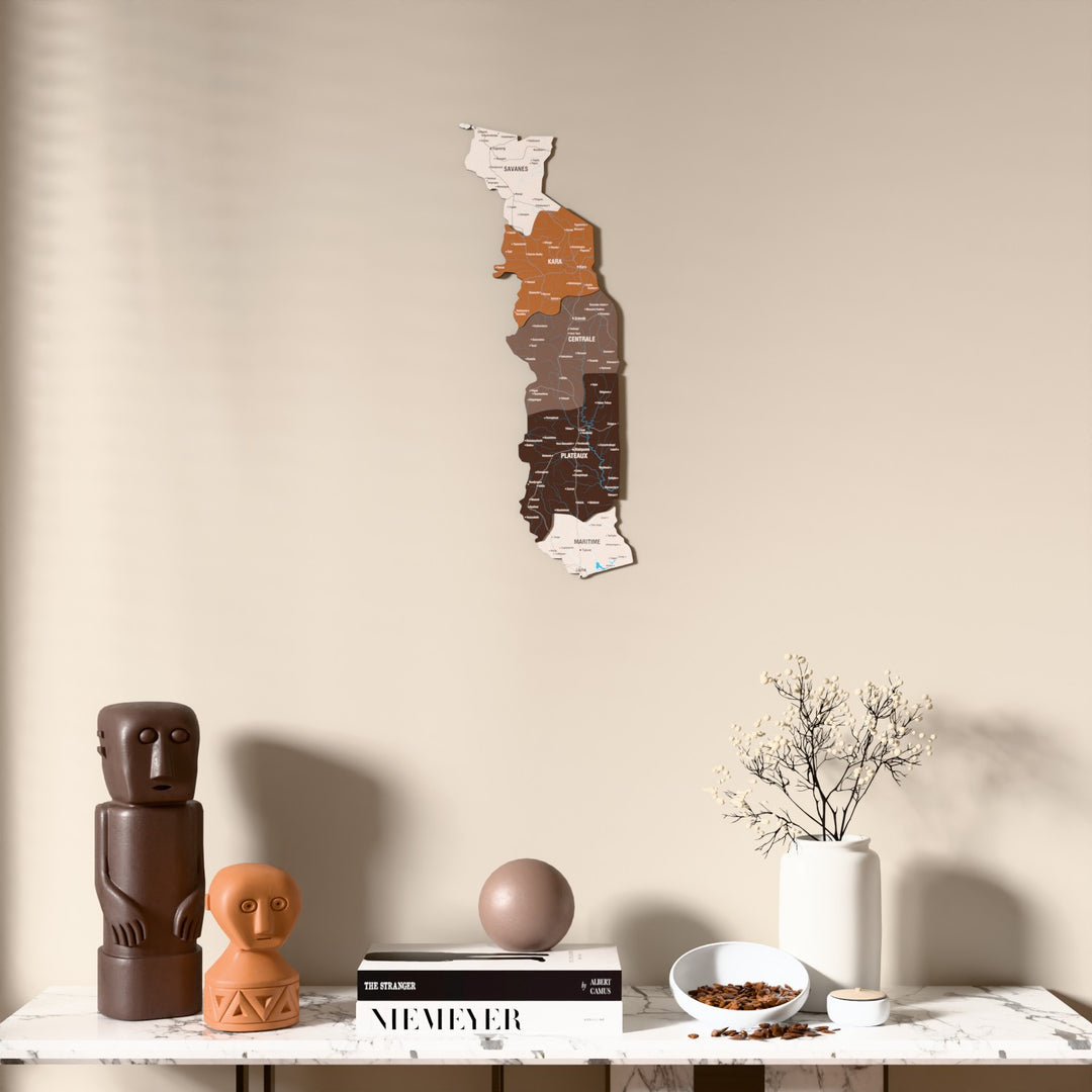 Soil Togo wooden wall map above a marble console, front view