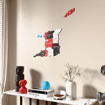 Flag colored Trinidad and Tobago wooden wall map beside a sheer curtain, angled view