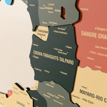 Close-up of the Sage Trinidad and Tobago wooden wall map with layered regions and printed names