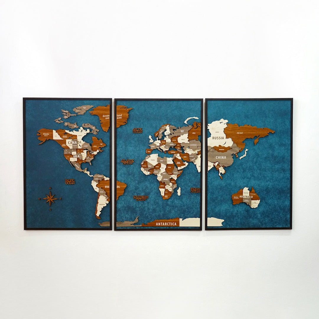 Three-panel wooden world map in a black frame on a deep blue background, front view