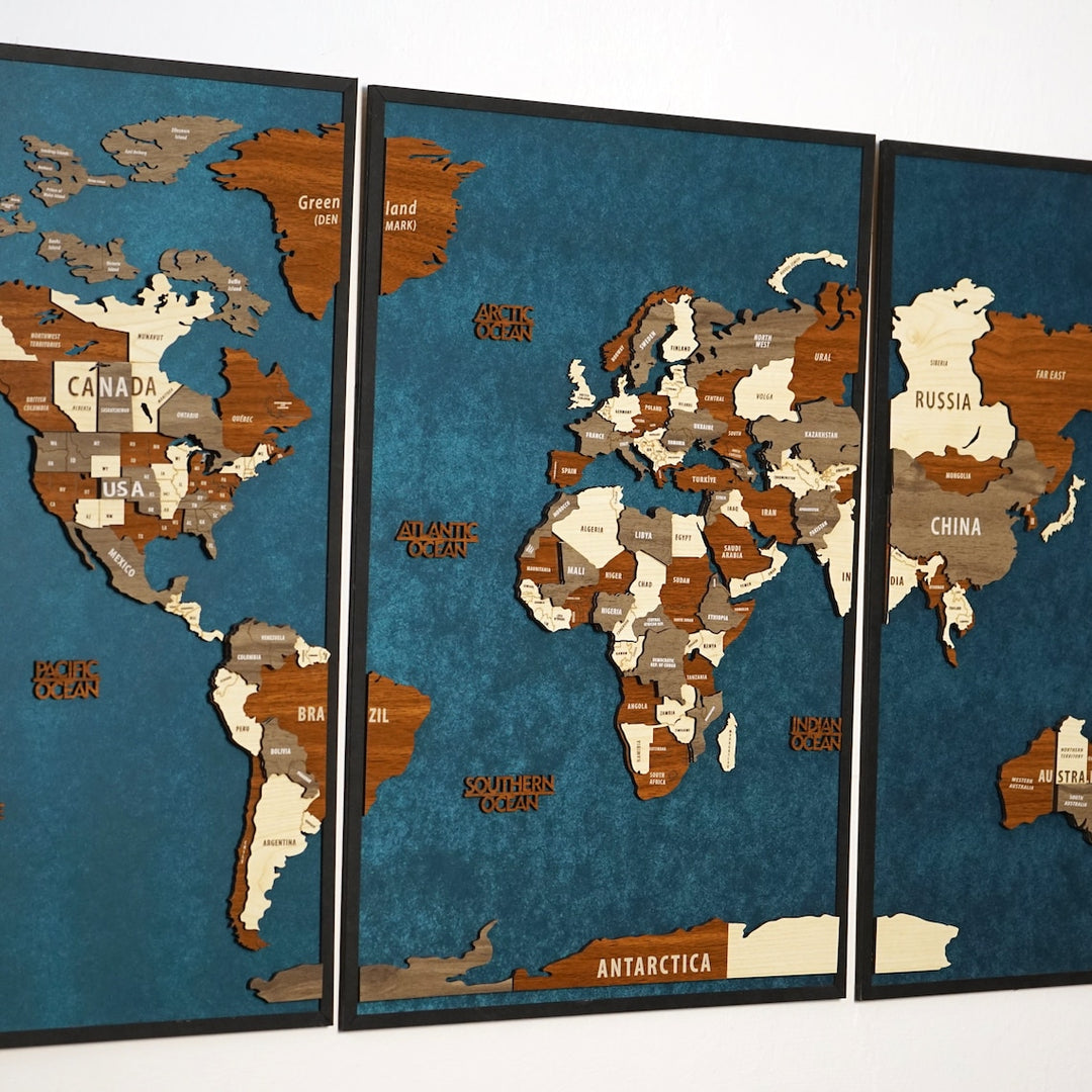 Close-up of the three-panel wooden world map with the Americas on the left panel and Europe and Africa in the center