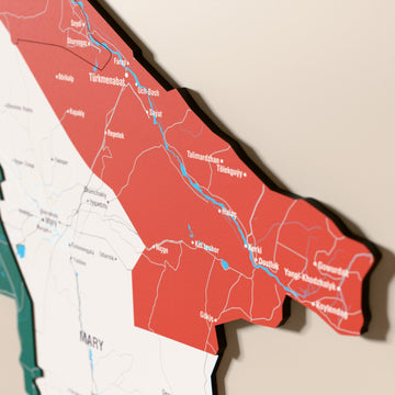 Close-up of the Flag colored Turkmenistan wooden wall map with layered regions and printed names