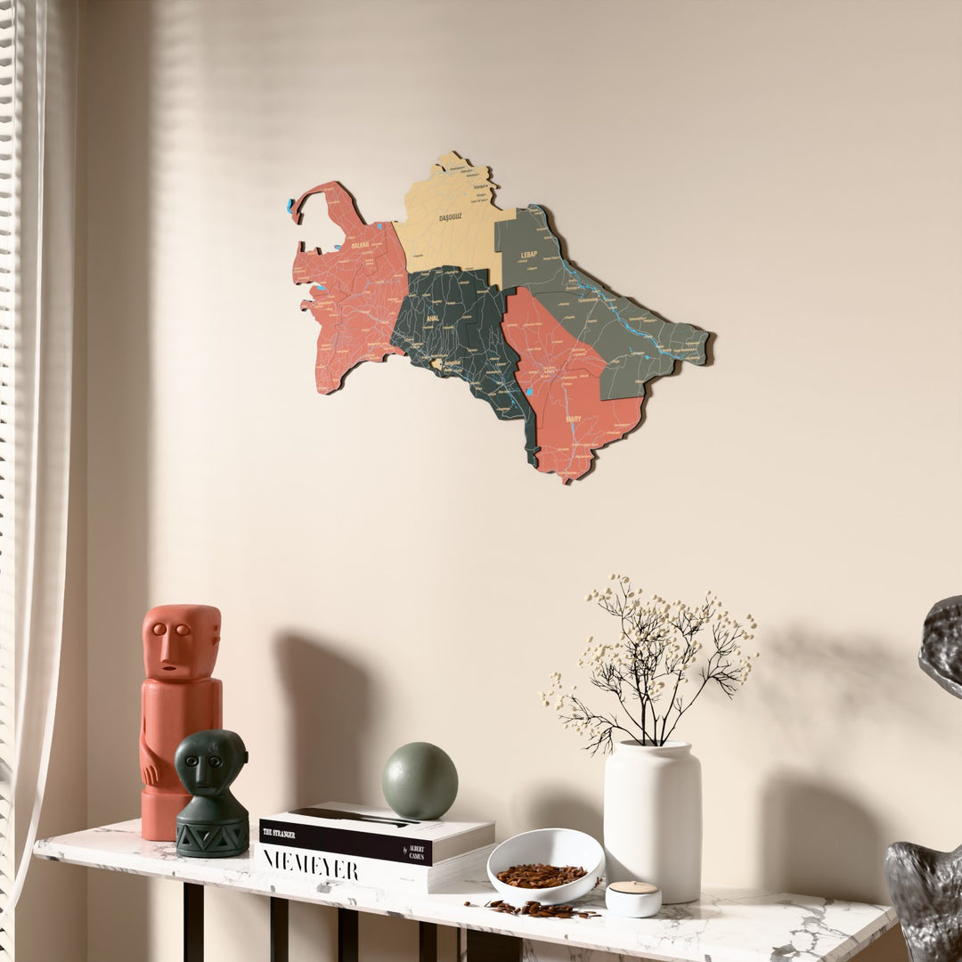Sage Turkmenistan wooden wall map beside a sheer curtain, angled view