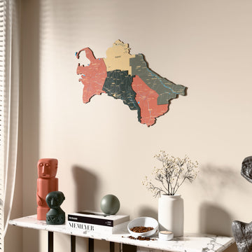 Sage Turkmenistan wooden wall map beside a sheer curtain, angled view