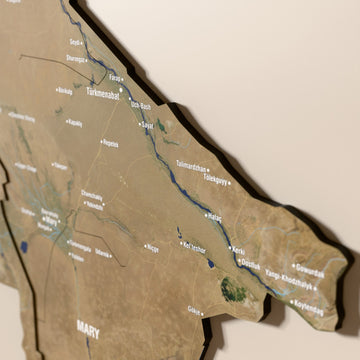 Close-up of the Satellite Turkmenistan wooden wall map with layered regions and printed names