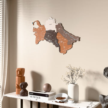 Soil Turkmenistan wooden wall map beside a sheer curtain, angled view