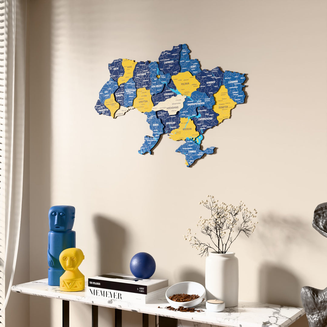 Flag colored Ukraine wooden wall map beside a sheer curtain, angled view