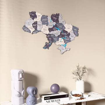 Nimbus Ukraine wooden wall map on a beige wall above a console with figurines