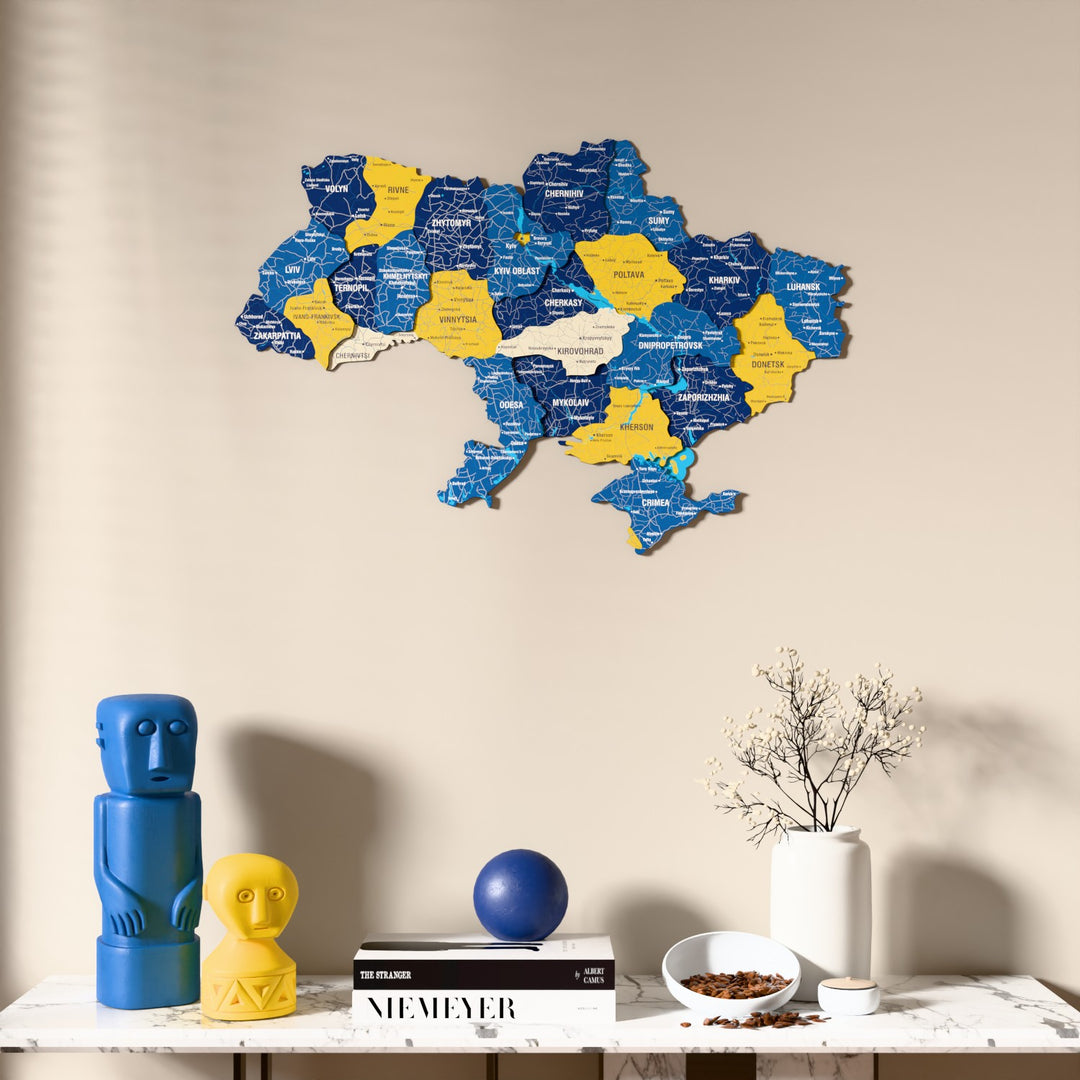 Flag colored Ukraine wooden wall map above a marble console, front view
