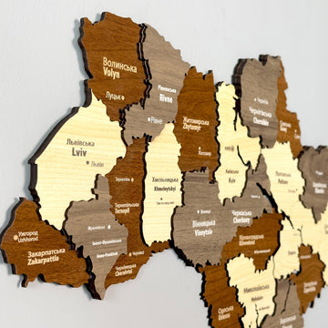 Close-up of Ukraine wooden map layers showing Lviv, Volyn, Rivne and Zakarpattia in Ukrainian and English