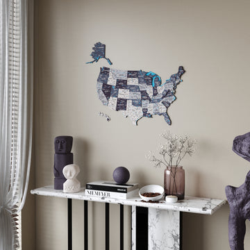 Nimbus wooden USA map above a marble console table beside a sheer curtain