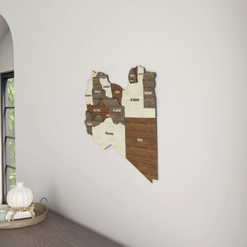 Libya wooden wall map in a room corner next to an arched window, with a tray below