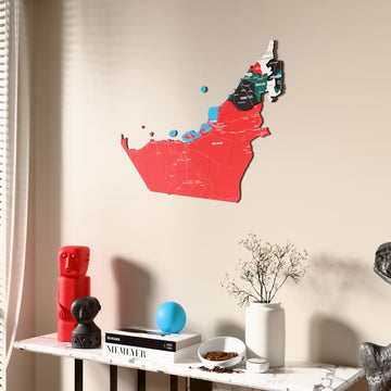 Flag colored United Arab Emirates wooden wall map beside a sheer curtain, angled view