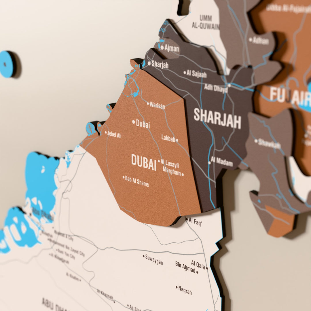 Close-up of the Soil United Arab Emirates wooden wall map with layered regions and printed names