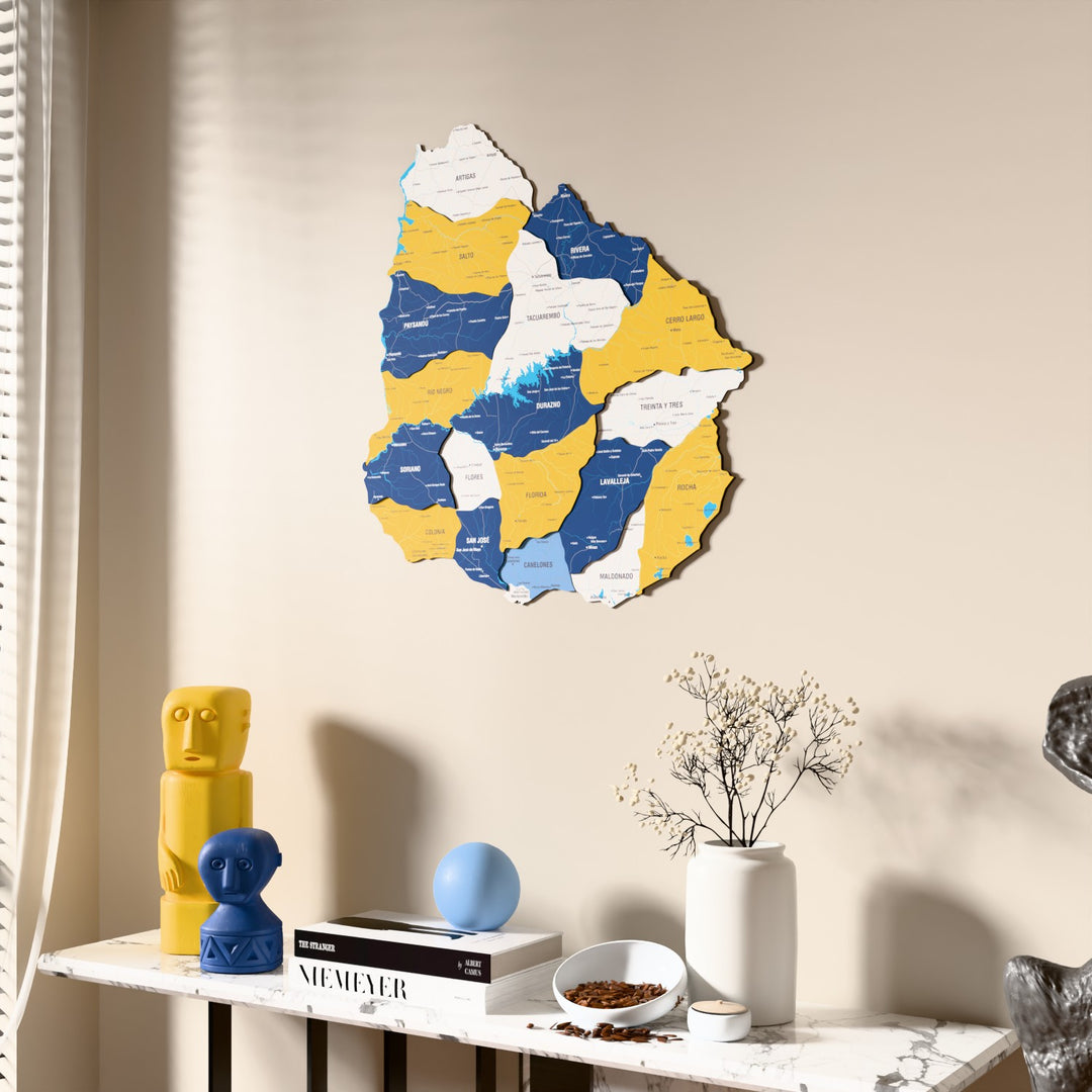 Flag colored Uruguay wooden wall map beside a sheer curtain, angled view